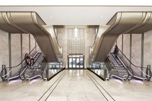 The upgraded escalator hall, Knightsbridge Store, London, UK - Architect: Make Architects - PVD coloured stainless steel trims: John Desmond Ltd
