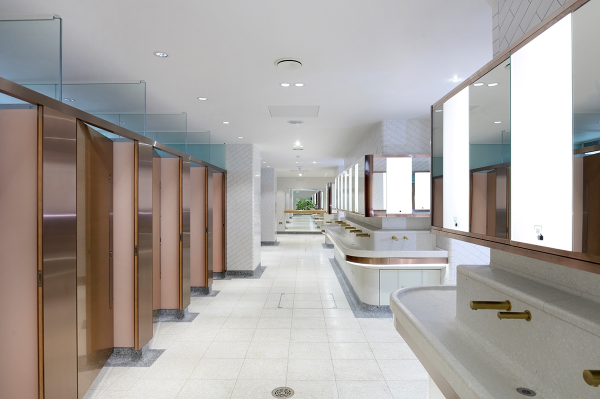 Visual for upgrade of WCs Victoria Station, London showing white, bronze and copper colour palette with indoor courtyard shown at the far end.  Client: Network Rail Architects: Landolt + Brown Fitout: Maxwood Washrooms PVD coloured stainless steel by Double Stone Steel Architectural metalwork by John Desmond Ltd Visual for upgrade of WCs Victoria Station, London showing white, bronze and copper colour palette with indoor courtyard shown at the far end.  Client: Network Rail Architects: Landolt + Brown Fitout: Maxwood Washrooms PVD coloured stainless steel by Double Stone Steel Architectural metalwork by John Desmond Ltd