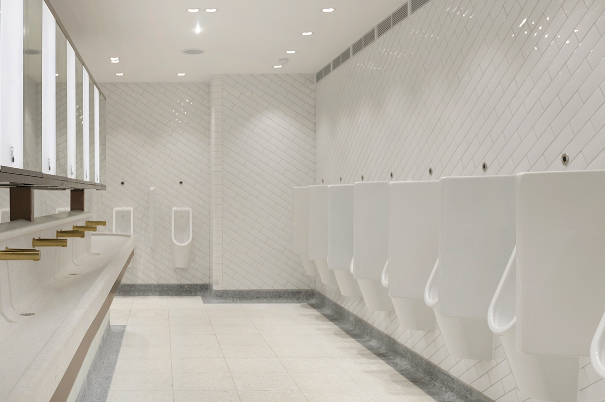 Interior of Gents urinals in the upgraded toilets, Victoria Station, London showing light, bright interior although underground. Interior of Gents urinals in the upgraded toilets, Victoria Station, London showing light, bright interior although underground.
