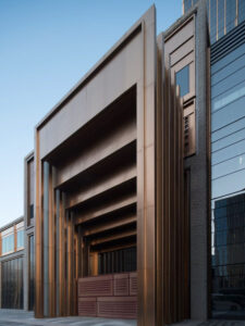 Stepped door entry at the Shanghai Bund Financial Centre in PVD coloured stainless steel, Rose Gold Vibration. - Architects: Foster & Partners; Heatherwick Studio - PVD coloured stainless steel:: Double Stone Steel in partnership with John Desmond Ltd.