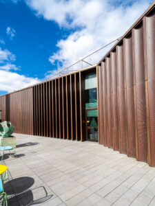 Roof extension in pre-oxidised copper and PVD coloured stainless steel in Copper. - Extension to Aberdeen Art Gallery, Schoolhill, Aberdeen, AB10 1FQ. - Architects: Hoskins Architects - Copper PVD cappings fabricated by John Desmond Ltd.